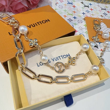 GOLD-TONE BAG CHAIN WITH PEARL DETAILS AND A LOGO CHARM