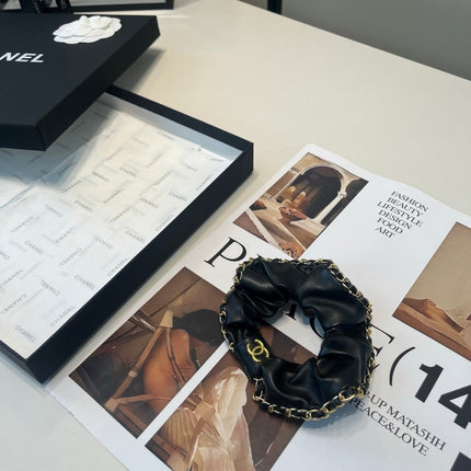 CHANEL 26S SCRUNCHIE IN BLACK LEATHER 512120