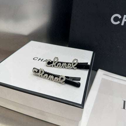 CHANEL 26S BOW HAIR CLIP IN BLACK RHINESTONE SCRIPT 505309