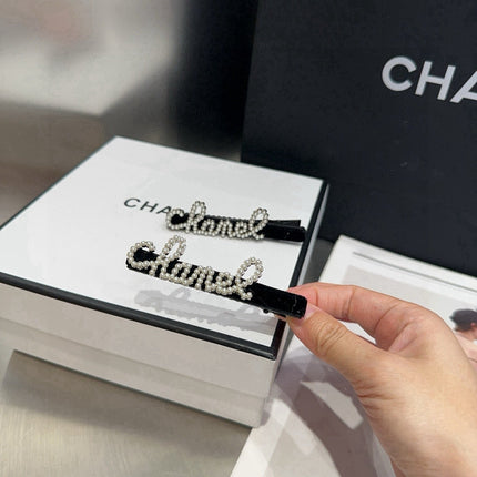 CHANEL 26S BOW HAIR CLIP IN BLACK RHINESTONE SCRIPT 505309