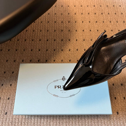 PRADA 26S BOW DETAIL SLINGBACK PUMPS 55MM IN BLACK PATENT CALFSKIN