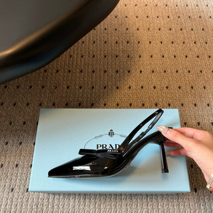 PRADA 26S BOW DETAIL SLINGBACK PUMPS 75MM IN BLACK PATENT CALFSKIN