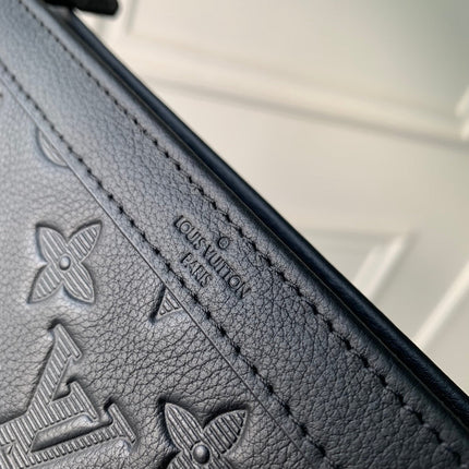 POCHETTE VOYAGE 22 IN BLACK MONOGRAM SHADOW CALFSKIN