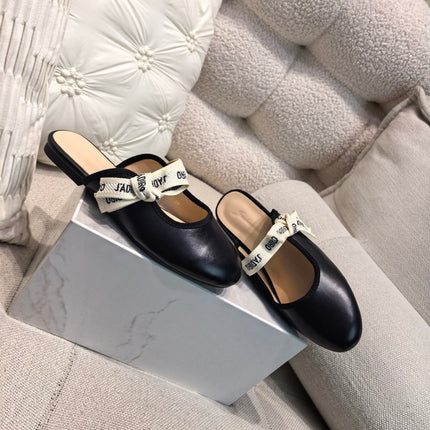 DIOR 26S FLAT MULES IN BLACK CALFSKIN WITH J'ADIOR BOW
