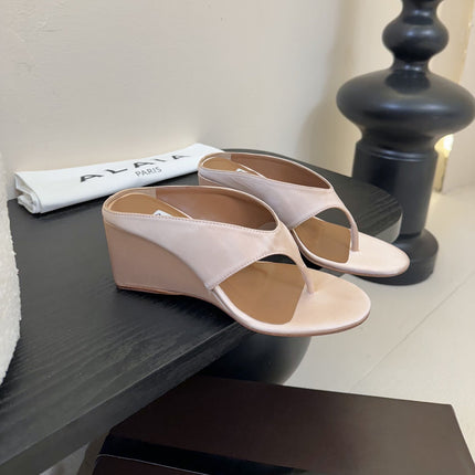 ALAIA WEDGE THONG SANDALS 25S IN BLUSH BEIGE SATIN