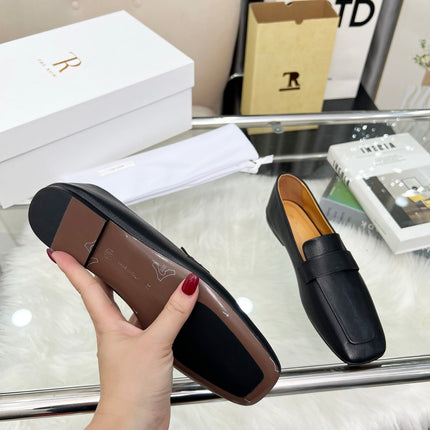 THE ROW 26S PENNY LOAFER FLATS IN BLACK GRAINED CALFSKIN