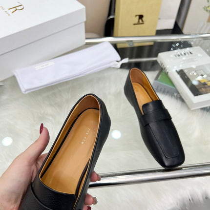 THE ROW 26S PENNY LOAFER FLATS IN BLACK GRAINED CALFSKIN
