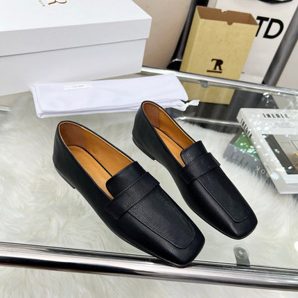 THE ROW 26S PENNY LOAFER FLATS IN BLACK GRAINED CALFSKIN