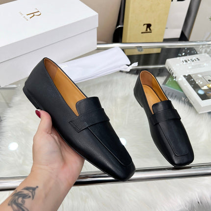 THE ROW 26S PENNY LOAFER FLATS IN BLACK GRAINED CALFSKIN