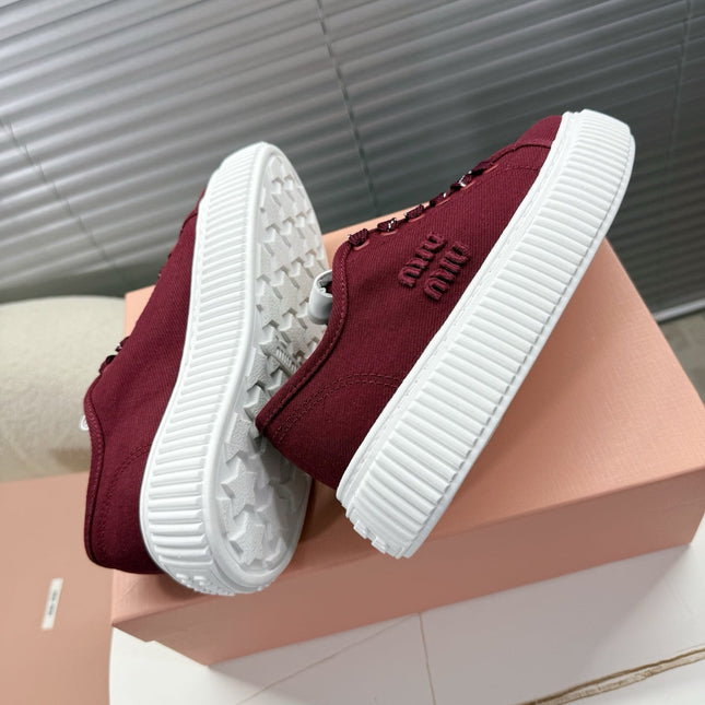 MIUMIU 26S PLATFORM SNEAKERS IN DARK RED CANVAS