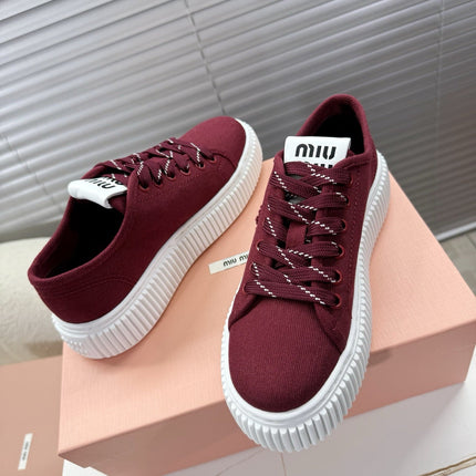MIUMIU 26S PLATFORM SNEAKERS IN DARK RED CANVAS
