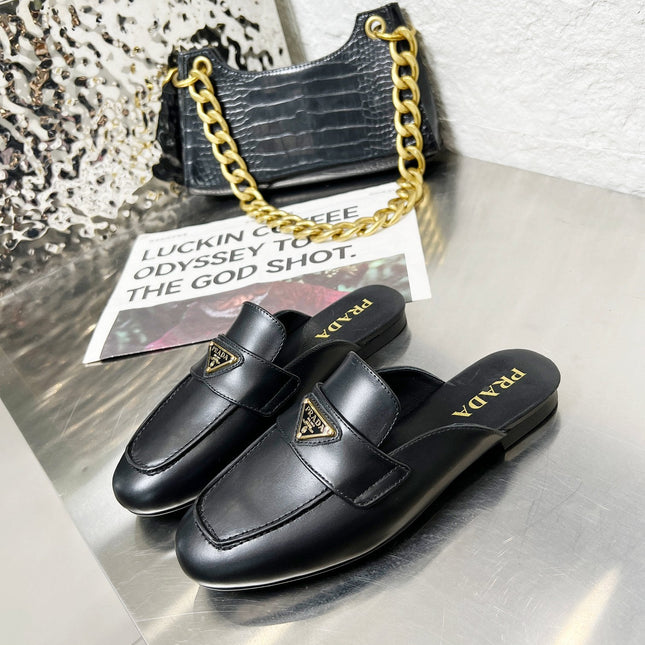 PRADA 26S MULE LOAFERS IN BLACK CALFSKIN WITH LOGO