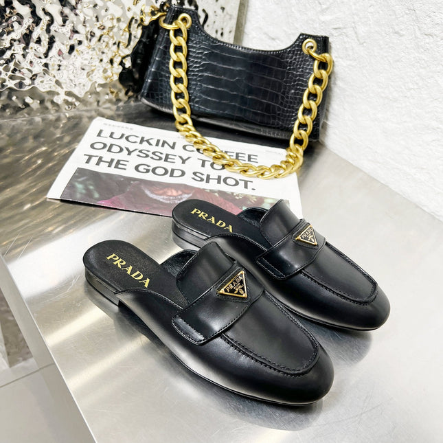 PRADA 26S MULE LOAFERS IN BLACK CALFSKIN WITH LOGO