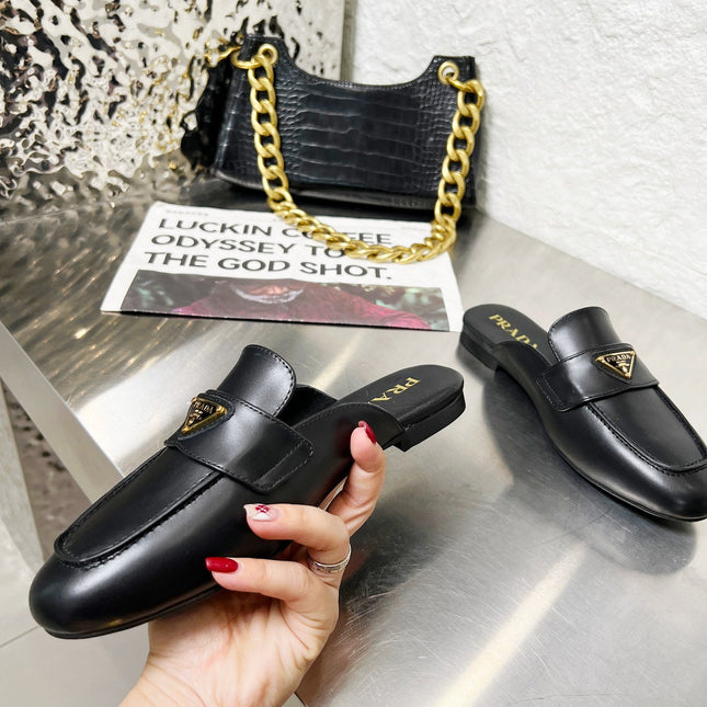 PRADA 26S MULE LOAFERS IN BLACK CALFSKIN WITH LOGO