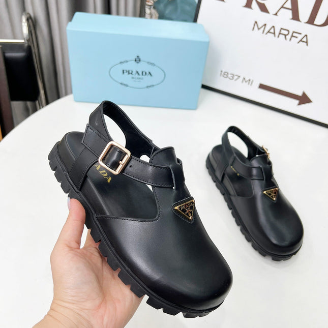 PRADA 26S RUBBER LOGO CHUNKY SOLE FISHERMAN SANDALS IN BLACK CALFSKIN