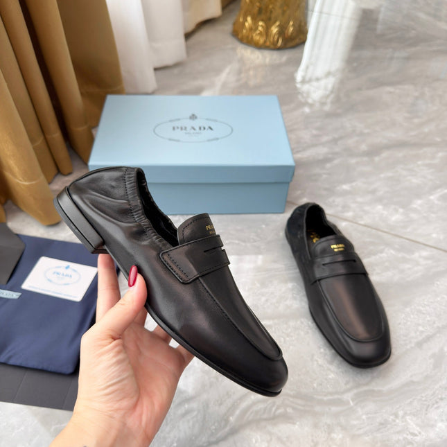 PRADA 25S LOAFERS IN BLACK CALFSKIN