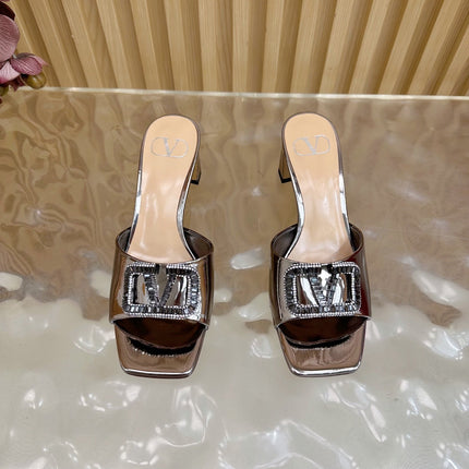VALENTINO 25S HIGH-HEEL MULES 60 MM IN METALLIC SILVER PATENT CALFSKIN WITH CRYSTAL-EMBELLISHED STRAP