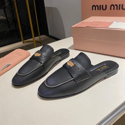 MULES SLIPPERS BLACK COWHIDE WITH GOLD COIN