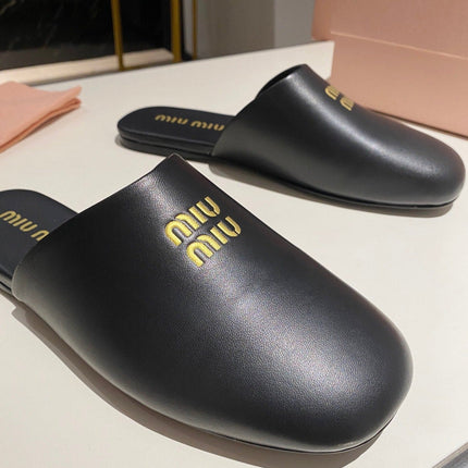 MULES SLIPPERS RETRO BLACK COWHIDE