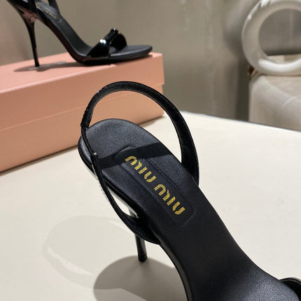 TWO STRAP HIGH HEELED SANDALS IN BLACK GLOSSY SHEEPSKIN