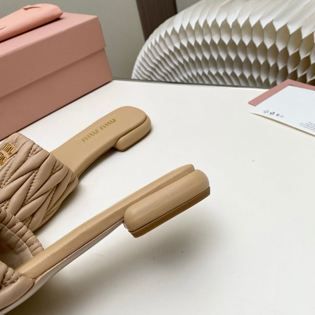 MIUMIU 26S MATELASSE SLIDES IN BEIGE CALFSKIN