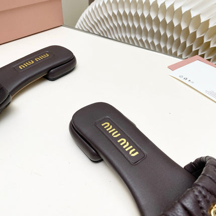 MIUMIU 26S MATELASSE SLIDES IN DARK BROWN CALFSKIN