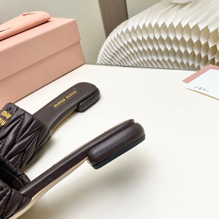 MIUMIU 26S MATELASSE SLIDES IN DARK BROWN CALFSKIN