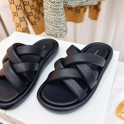 THE ROW 26S CROSSED PADDED SLIDES IN BLACK CALFSKIN