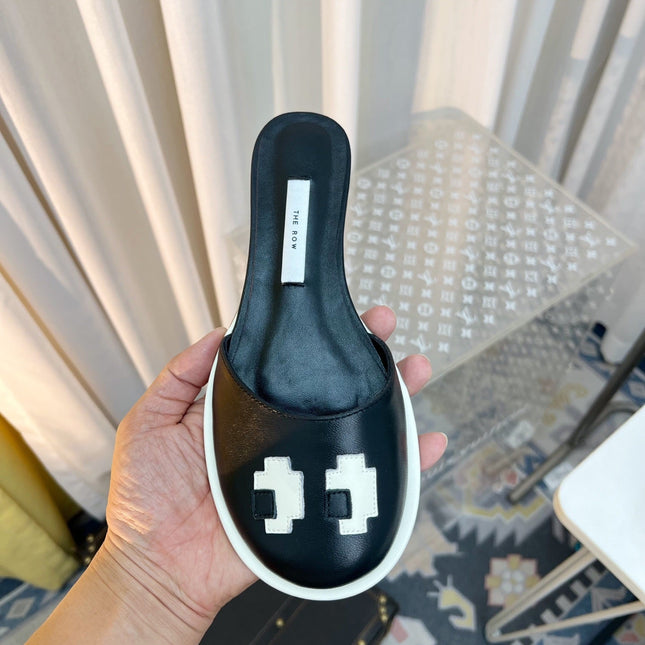 THE ROW 26S PIXEL APPLIQUE MULES IN BLACK CALFSKIN