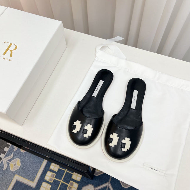 THE ROW 26S PIXEL APPLIQUE MULES IN BLACK CALFSKIN