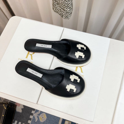 THE ROW 26S PIXEL APPLIQUE MULES IN BLACK CALFSKIN