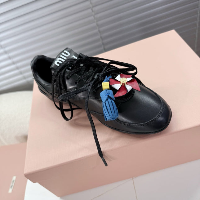 MIUMIU 26S GYMNASIUM SNEAKER IN BLACK CALFSKIN WITH GOLD BUCKLED STRAP