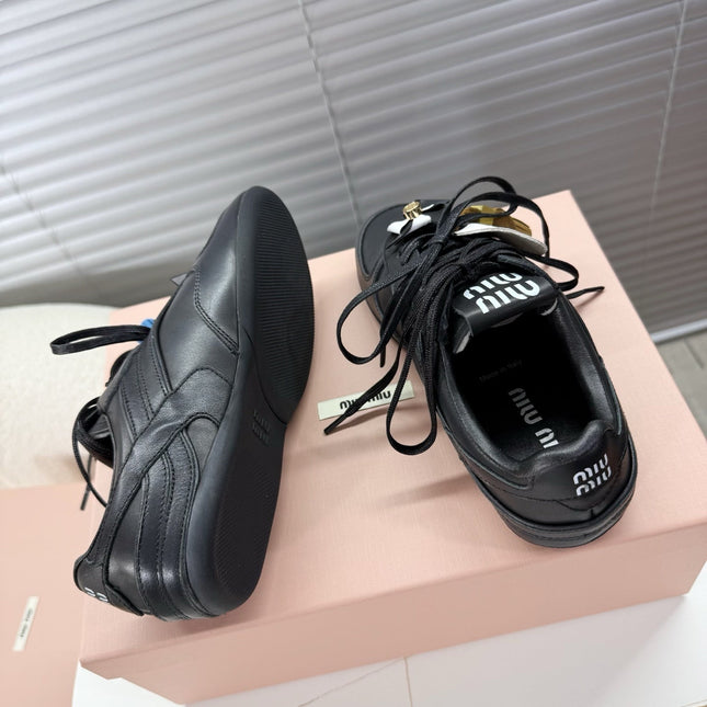 MIUMIU 26S GYMNASIUM SNEAKER IN BLACK CALFSKIN WITH GOLD BUCKLED STRAP