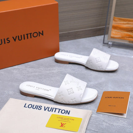 LV 26S FLAT SLIDE SANDALS IN WHITE CALFSKIN EMBOSSED MONOGRAM LOGO