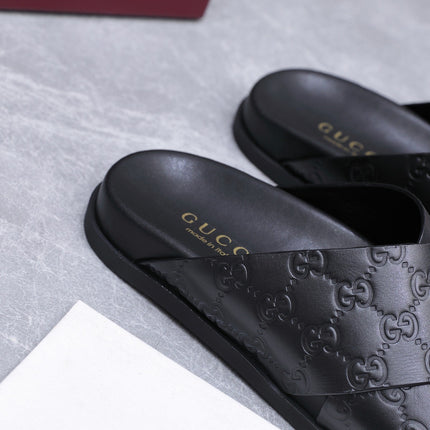 GUCCI 26S CROSSOVER SANDALS IN BLACK GG EMBOSSED CALFSKIN