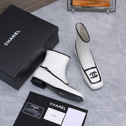 CHANEL 26S ANKLE BOOTS IN WHITE CALFSKIN WITH BLACK PATENT LEATHER TRIM AND CC LOGO ON TOE CAP