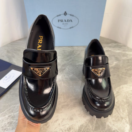 PRADA 26S HEELED LOAFERS 85 MM IN BLACK CALFSKIN