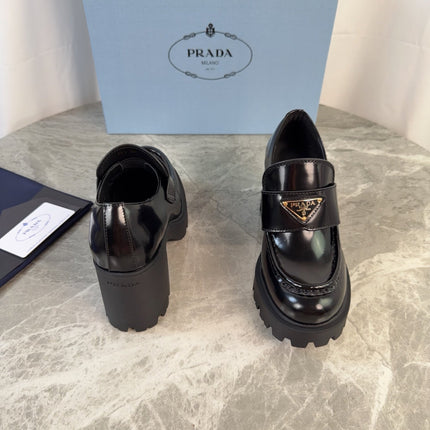PRADA 26S HEELED LOAFERS 85 MM IN BLACK CALFSKIN