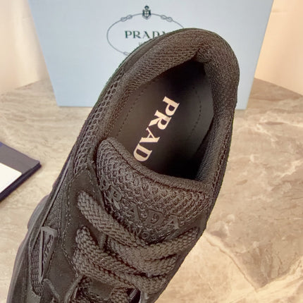 PRADA 26S GEAR SOLE SNEAKERS IN BLACK SUEDE AND MESH