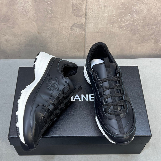 CHANEL 26S RUNNER CC LOGO SNEAKERS IN BLACK CALFSKIN