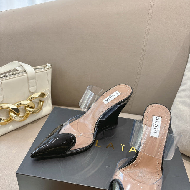 ALAIA 26S HIGH-HEEL WEDGE MULES 95 MM IN BLACK GLOSSY CALFSKIN