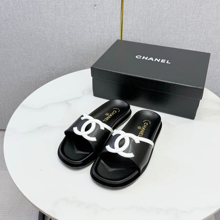 CHANEL 26S ICONIC CC SLIDES IN BLACK LAMBSKIN