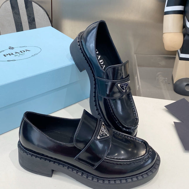 PRADA 26S LOAFERS IN BLACK CALFSKIN WITH LOGO SILVER HARDWARE