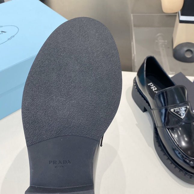 PRADA 26S LOAFERS IN BLACK CALFSKIN WITH LOGO SILVER HARDWARE