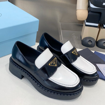 PRADA 26S LOAFERS IN BLACK AND WHITE CALFSKIN WITH LOGO