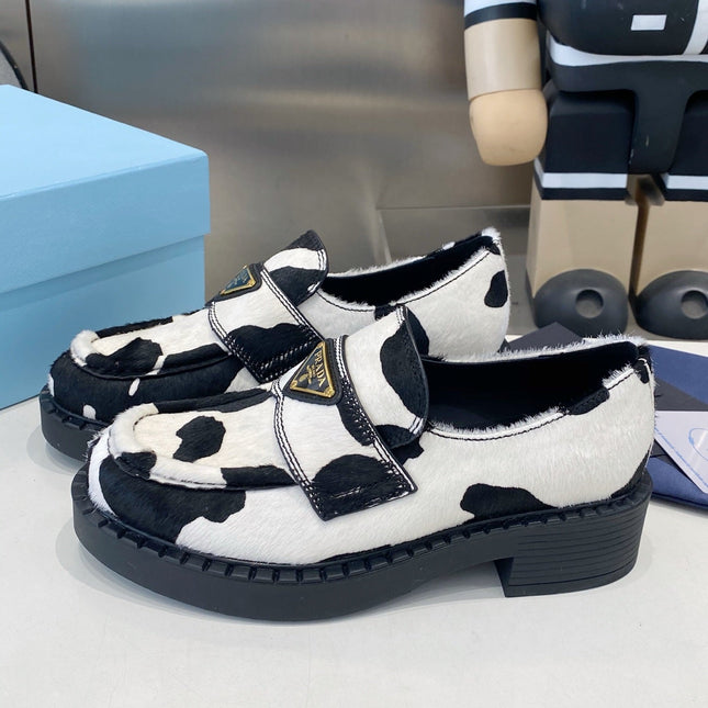 PRADA 26S LOAFERS IN WHITE AND BLACK COW PRINT PONY HAIR