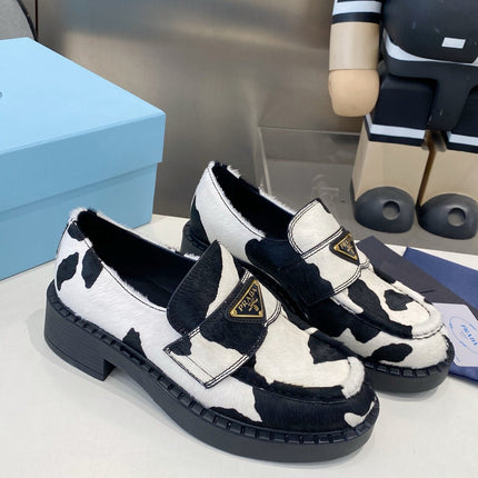 PRADA 26S LOAFERS IN WHITE AND BLACK COW PRINT PONY HAIR