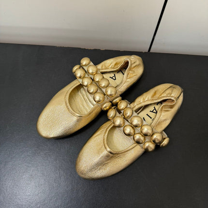 ALAIA SPHERE BALLET FLATS IN GOLDEN LAMBSKIN