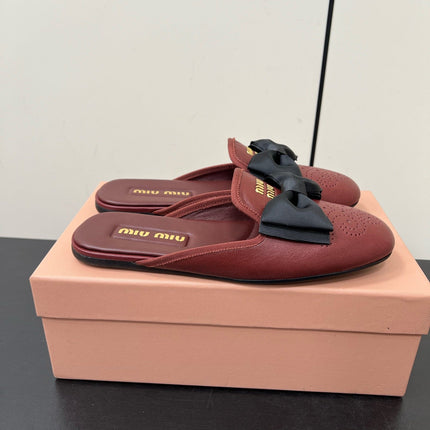 BOW MULES IN RED BROWN SHEEPSKIN