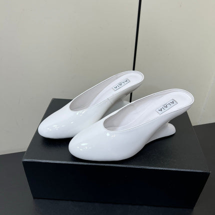 ALAIA WEDGE MULES 25S IN CREAM WHITE LAMBSKIN